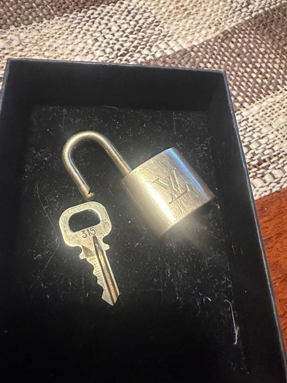#315. Louis Vuitton Gold-Tone Padlock with Matching Key
